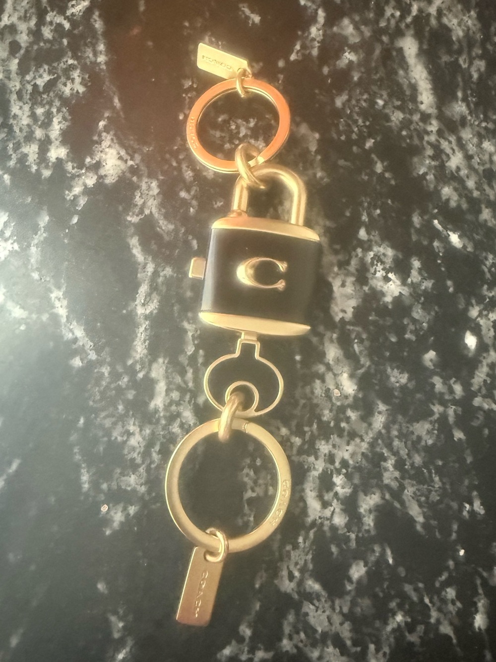Coach Gold and Black Padlock Keychain with Signature 'C'